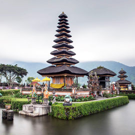 Bedugul-Temple Famous Bedugul temple surrounded by colourful sun umbrellas and translucent volcanic lake