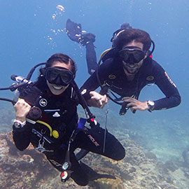 Try diving Scuba diving instructor and an excited diving student on his first every try dive